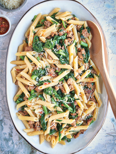 Gluten-free pasta with sausages and rapini